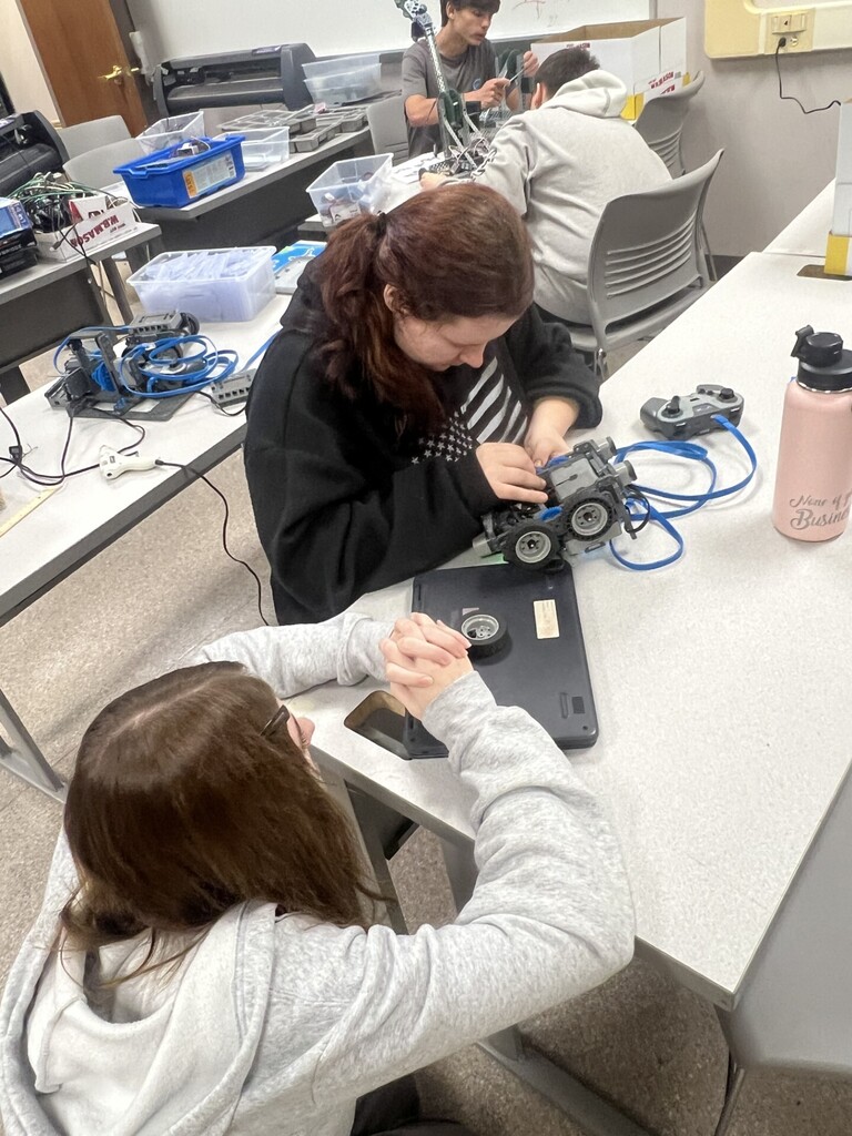Students working with robots