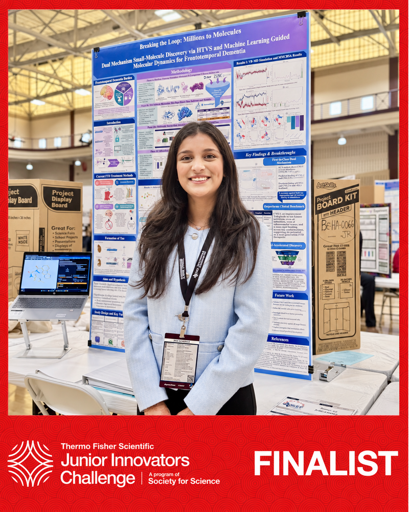 a student in front of a poster board