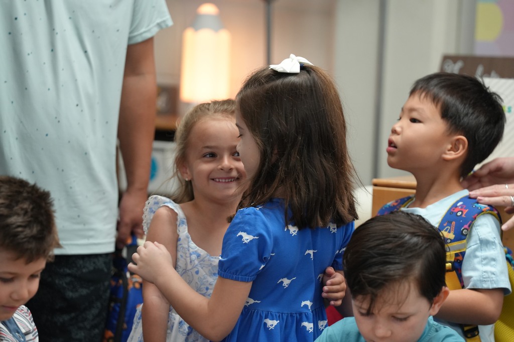 two students hugging