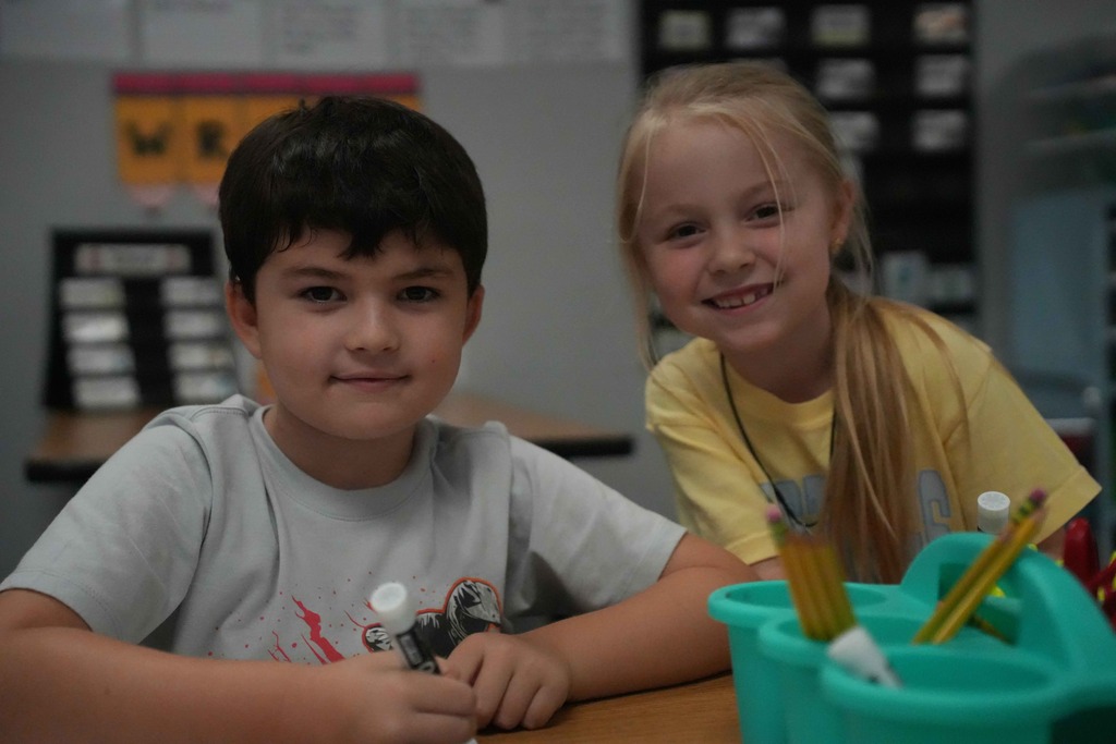 Boy and girl smiling 