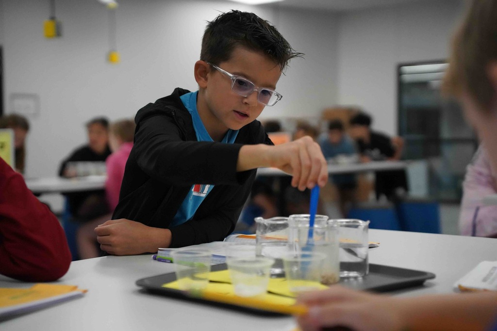 boy doing science project