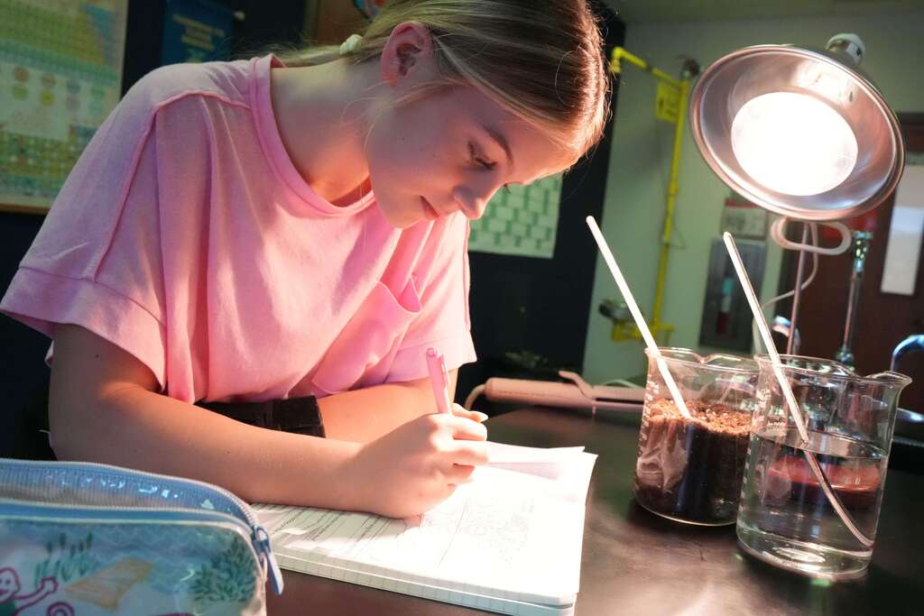 student taking notes 