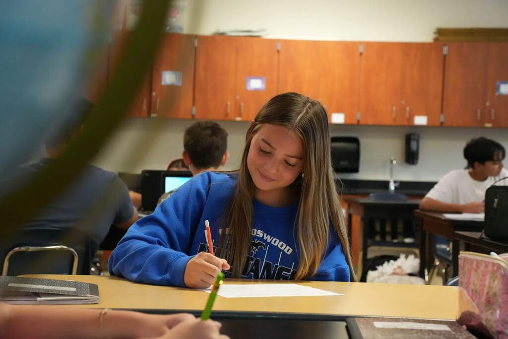 student taking notes 
