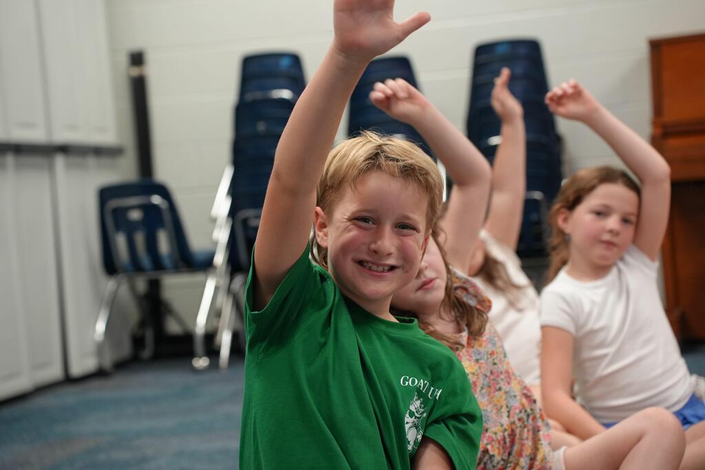 student raising their hand