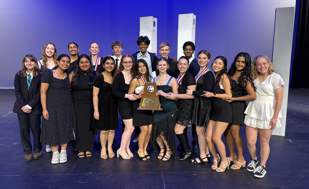 Group of theater students holding a plaque