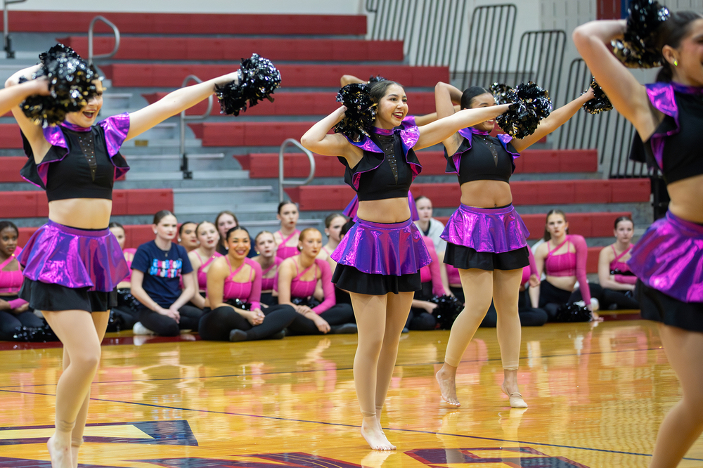 Dance team in black and purple performs at FISD Dance Showoffs