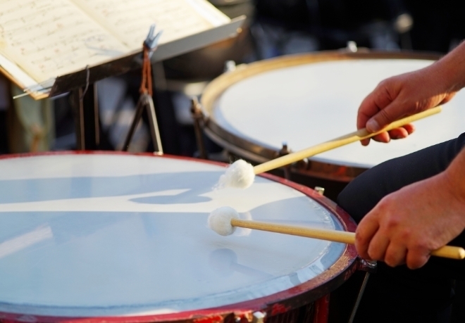 Person drumming on a timpani
