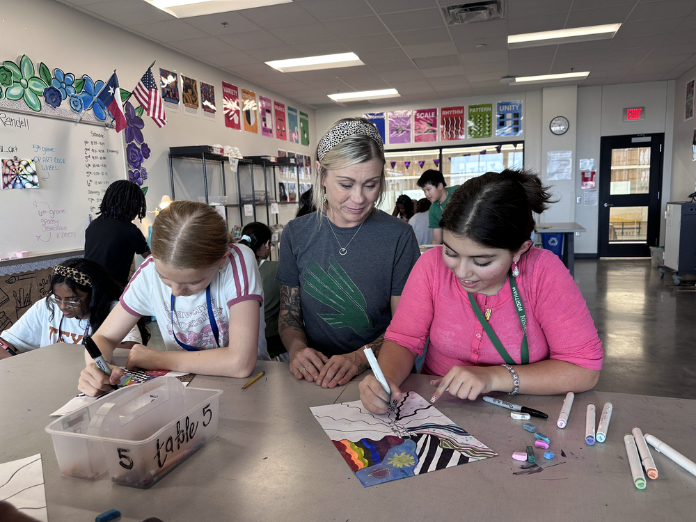 An art teacher and two students