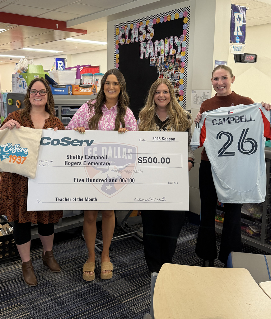 Four people holding a large check from Coserv and FC Dallas