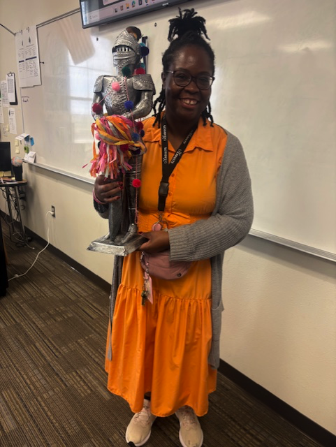 Teacher holding award