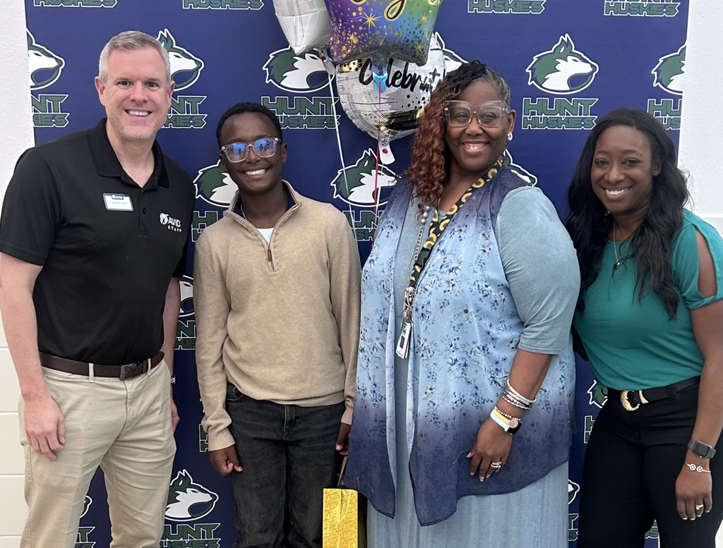 AVID staff, Biruk Teferi, AVID teacher LaTisha Johnson and principal Victoria Williams