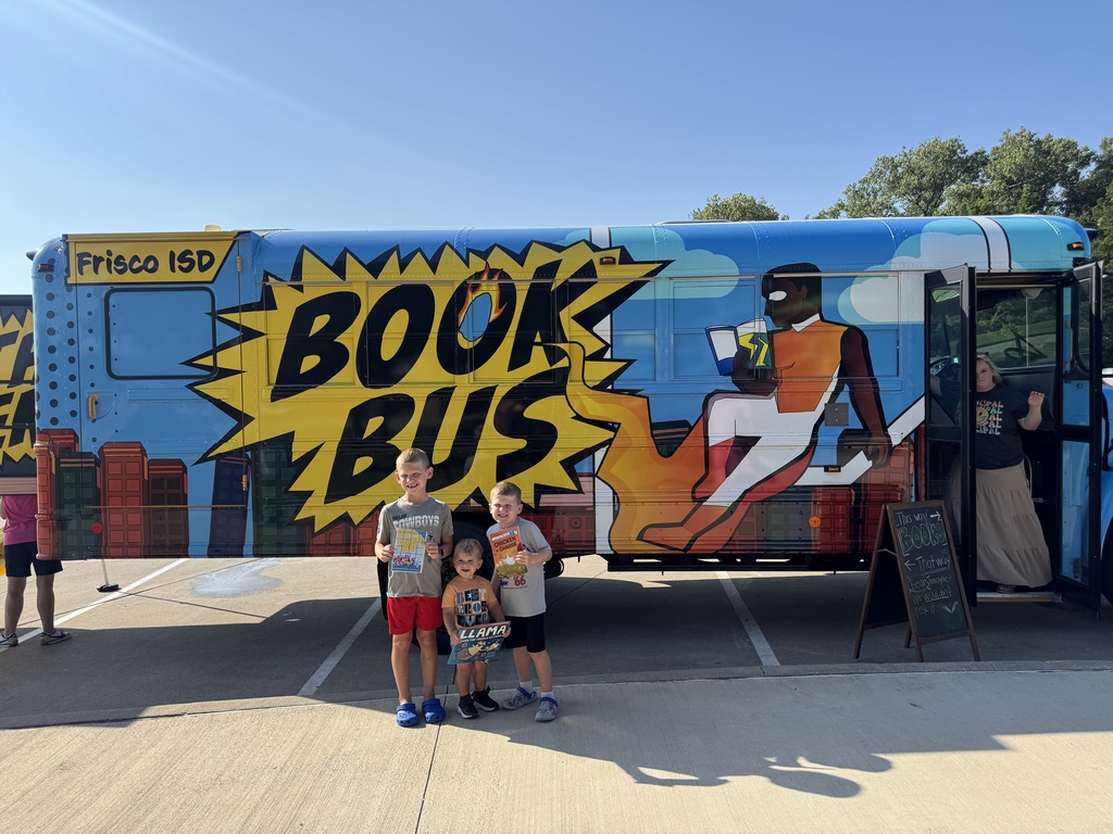 Students in front of book bus