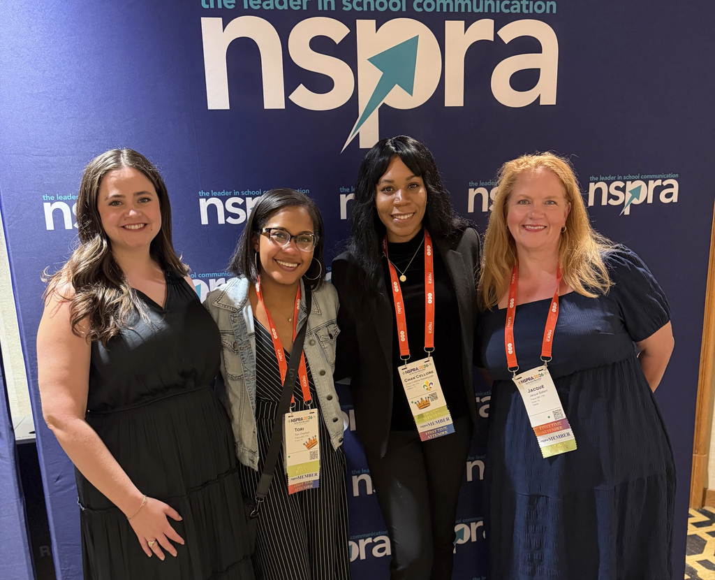 Four women standing in front of an NSPRA background