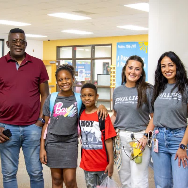 teachers and a family