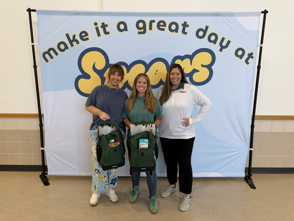 Carter, center, with her supply-stuffed backpacks from UTD athletics (pictured with principal Katie Reedy and UTD athletics director Angela Marin)