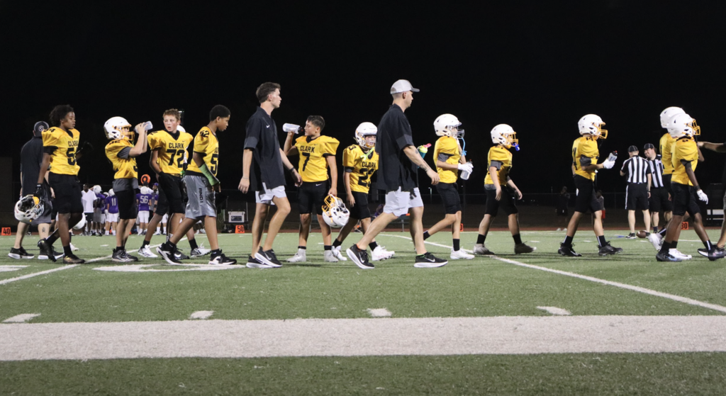 Football players lining up for the post-game handshake