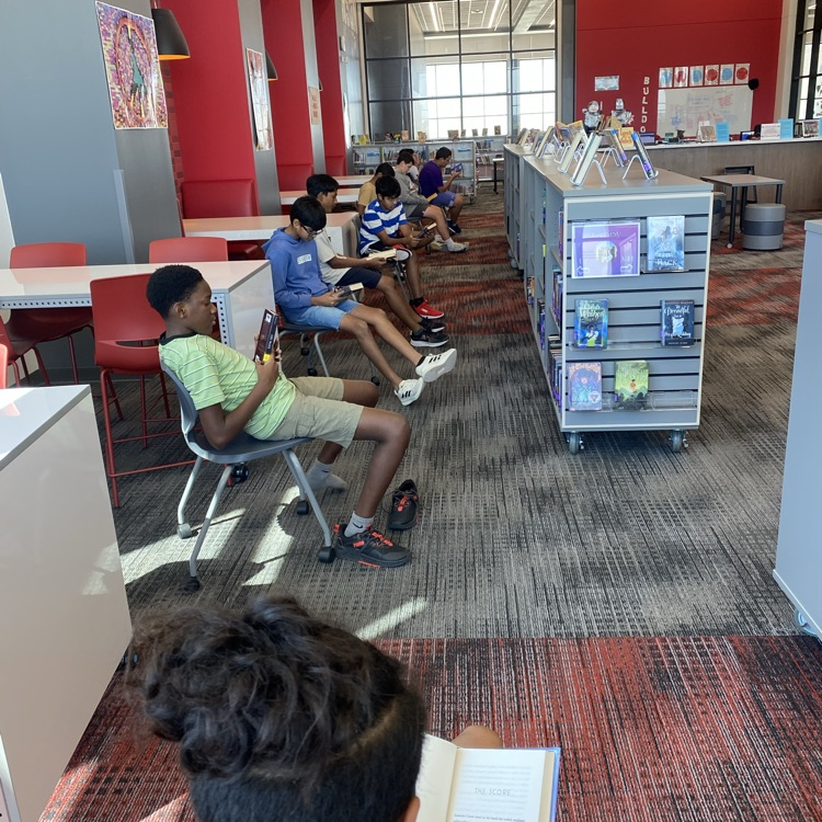 7th and 8th grade students visited the library to find new books by playing musical chairs. 