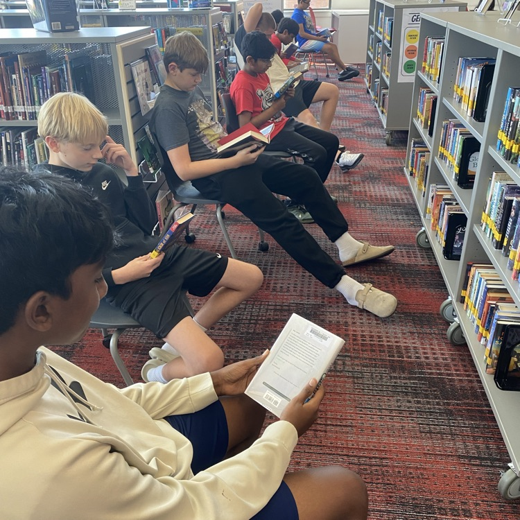 7th and 8th grade students visited the library to find new books by playing musical chairs. 