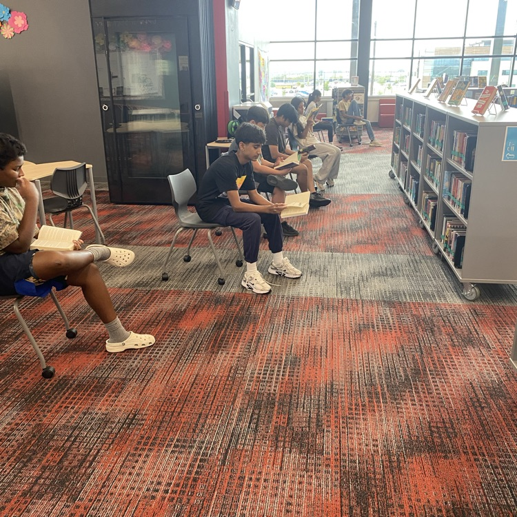 7th and 8th grade students visited the library to find new books by playing musical chairs. 