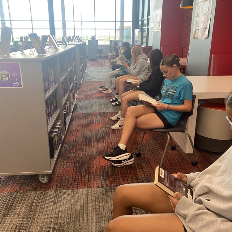 7th and 8th grade students visited the library to find new books by playing musical chairs. 