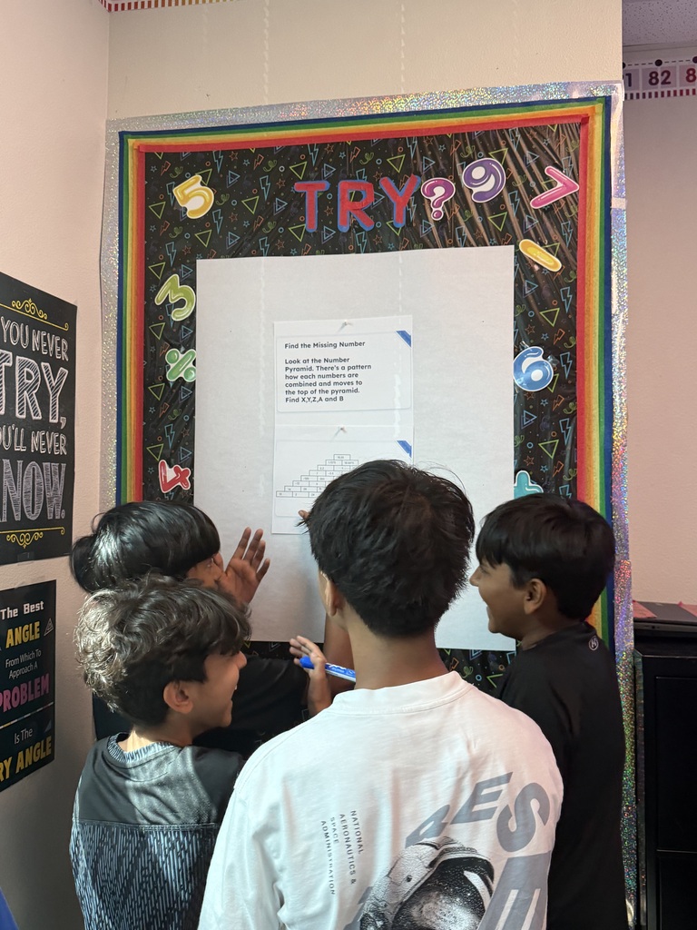 Four math students solving a problem