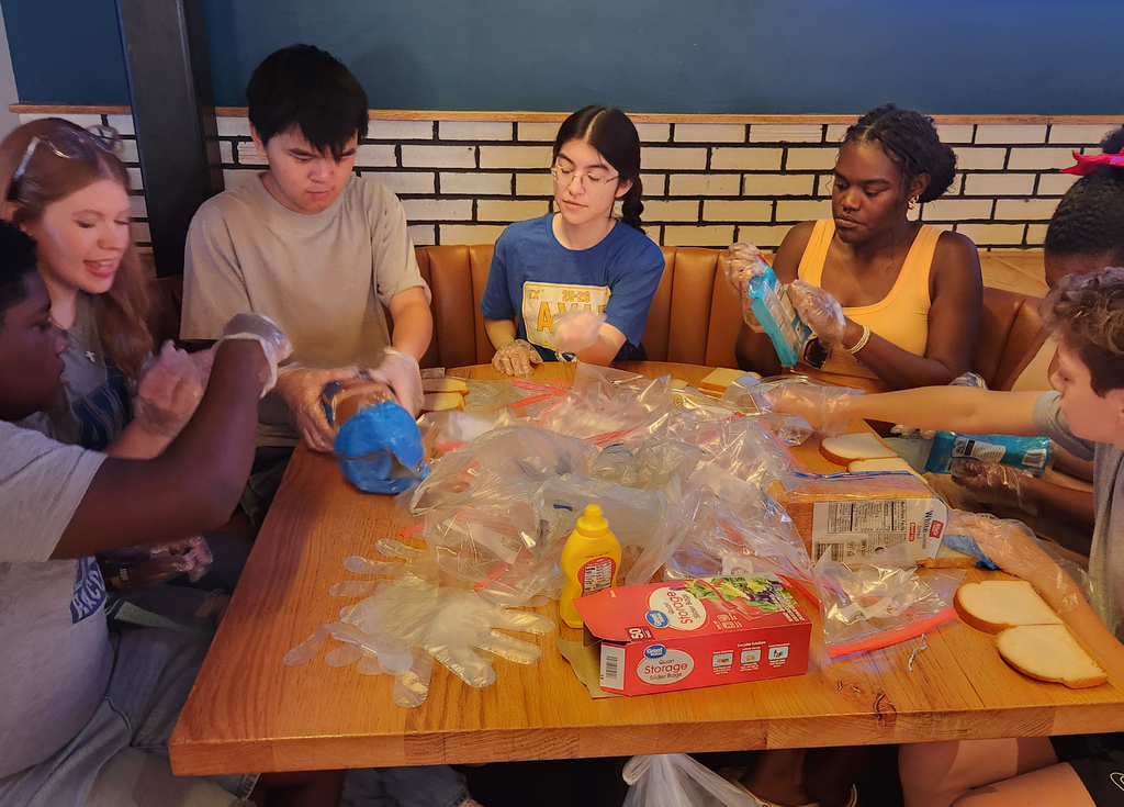 Frisco and Hunt students make sandwiches with Tango Charities Feed the Country.