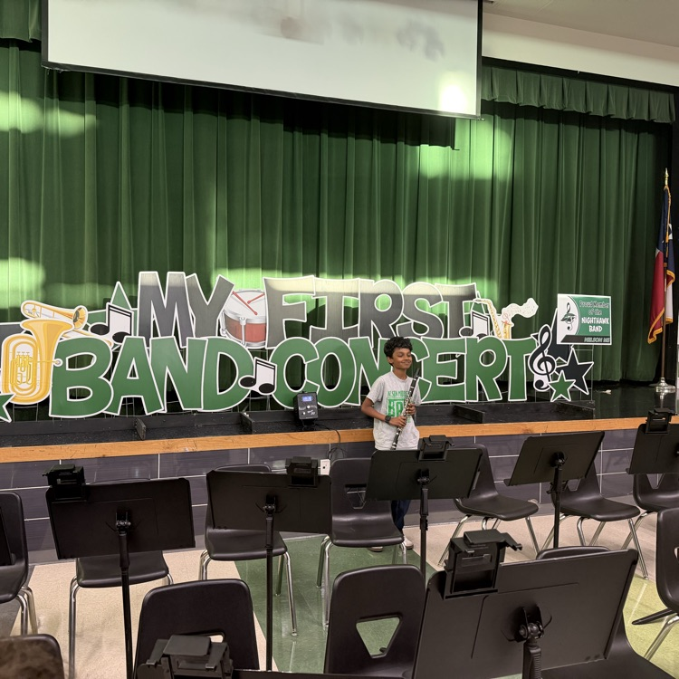 Middle school students performing in a band concert