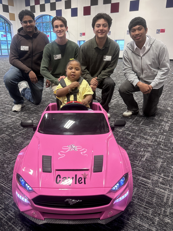 Caylei is pictured with four CTE Center students who modified her vehicle