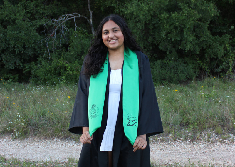 Female student holding a degree
