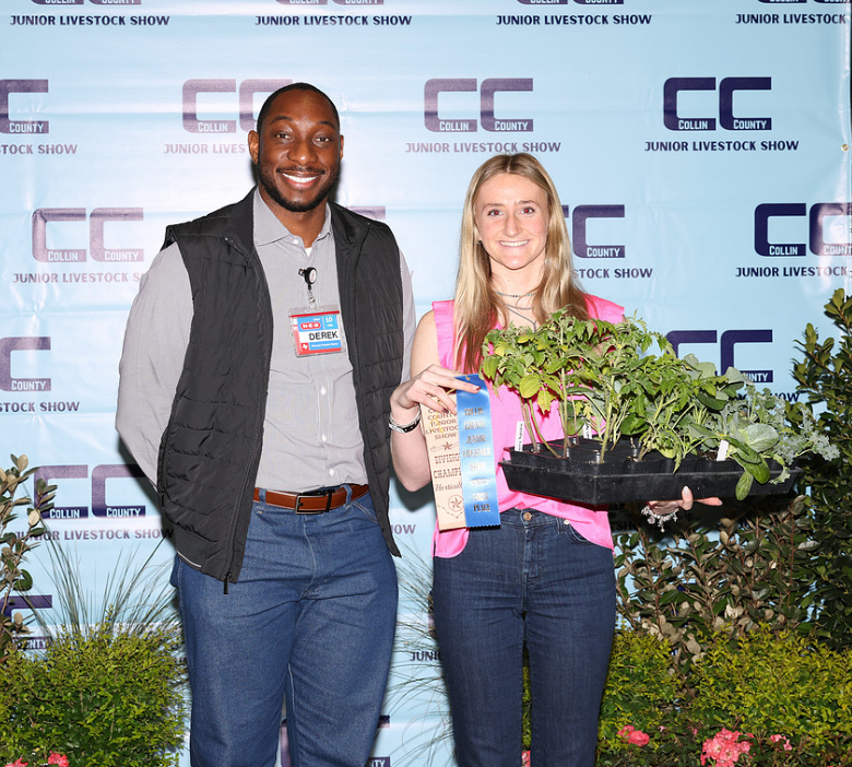 Student and adult with a plant