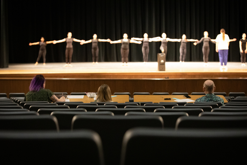 Judges assess dance students