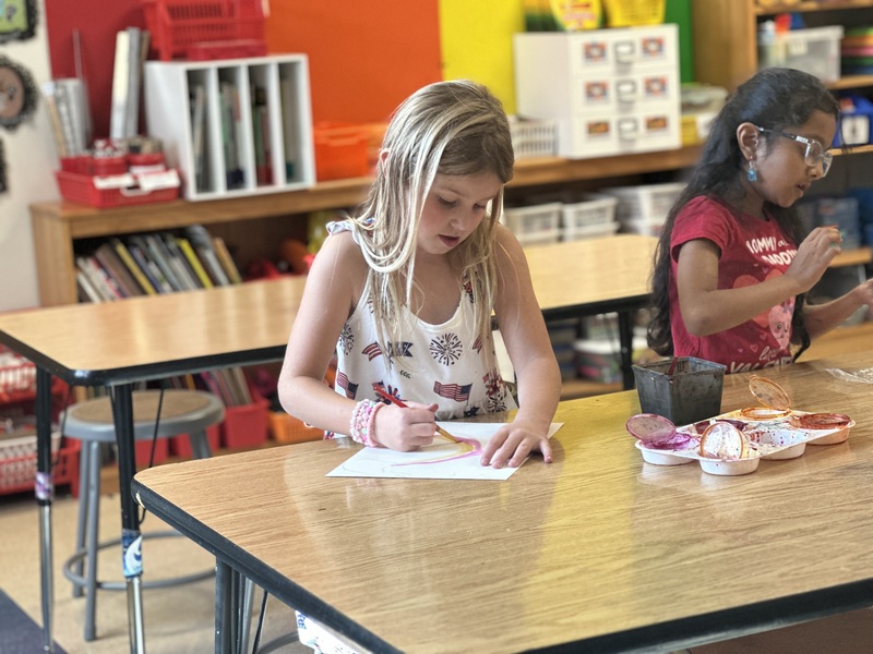 Girl painting in art class
