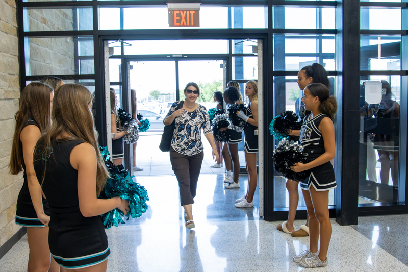 New staff is welcomed by the Panther Creek High School cheer team