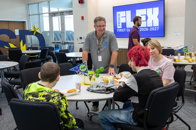Principal Bigenho welcomes Frisco Flex students to the event