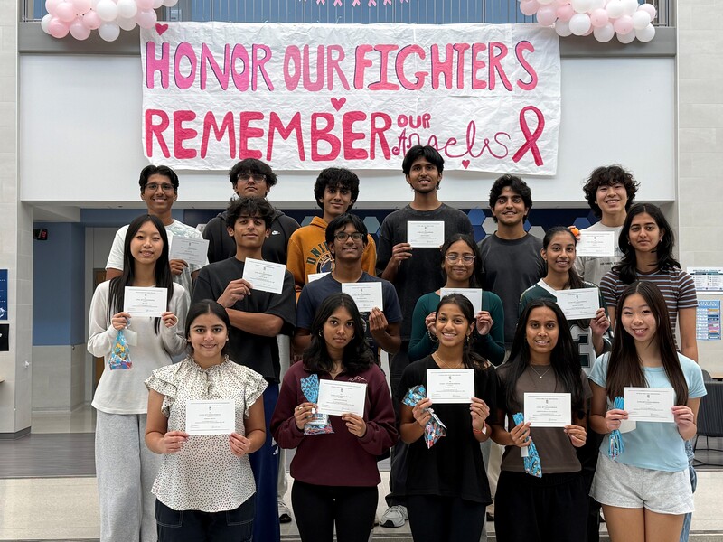 Students holding certificates