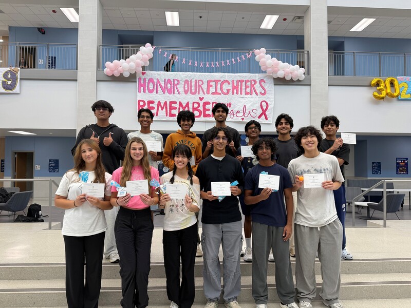Students holding certificates