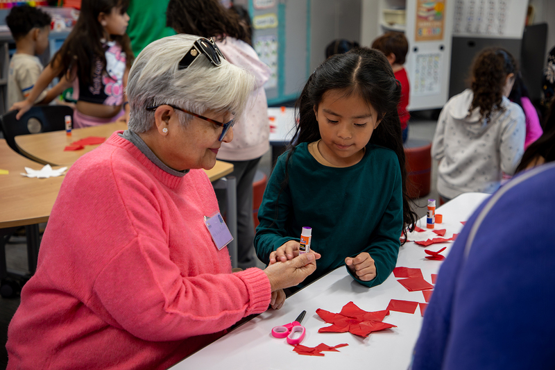 Seniors and Christie students work on ornaments.