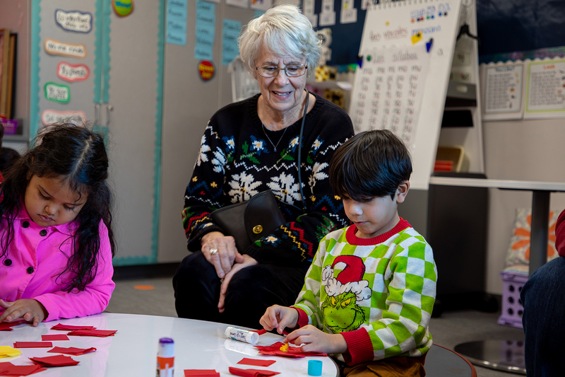 Seniors and Christie students work on ornaments.