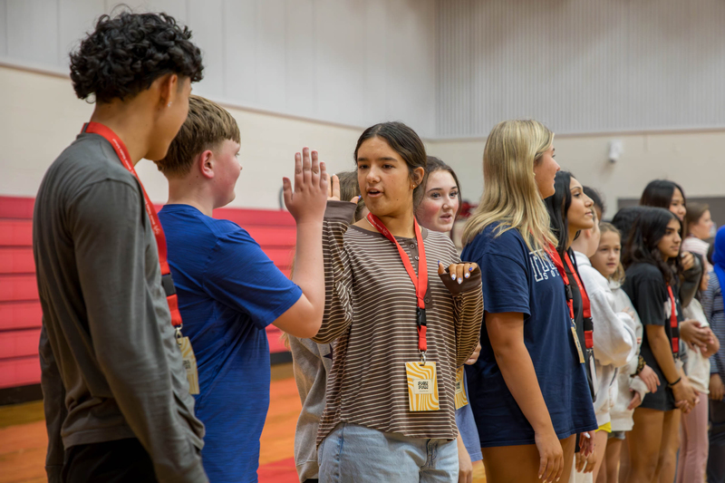 Centennial PAL high-fives a Wester PALee