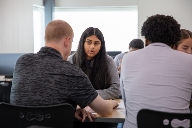 An architecture student receives project feedback from an industry expert.