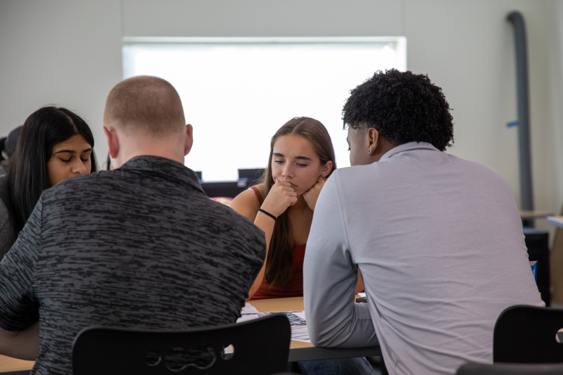 An architecture student receives project feedback from an industry expert.