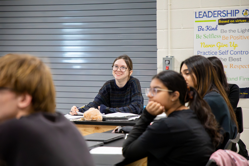A student smiles in the Animal Science class.