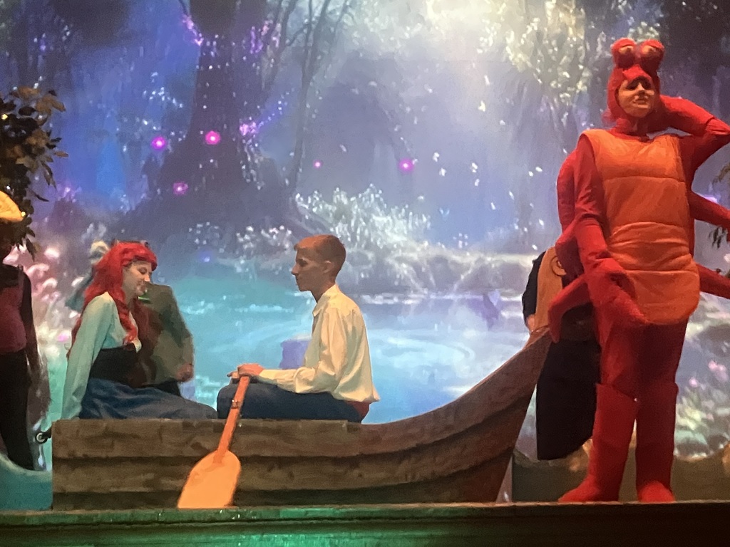 Sebastian sings to the couple