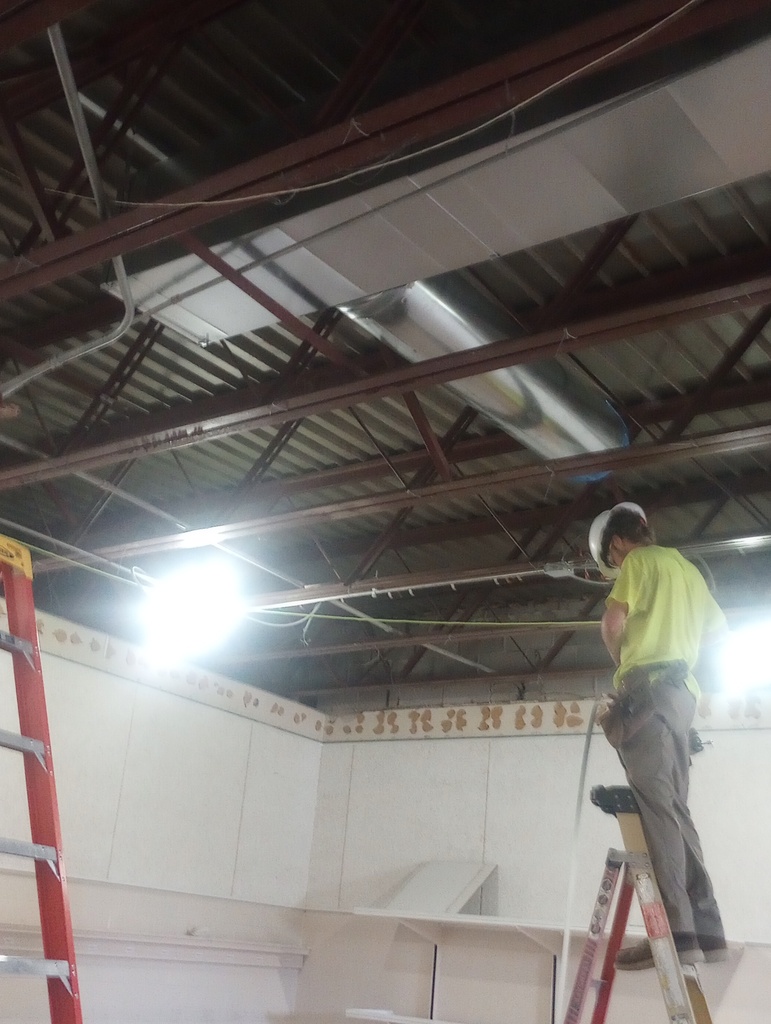 Ductwork installation in the Band Room.