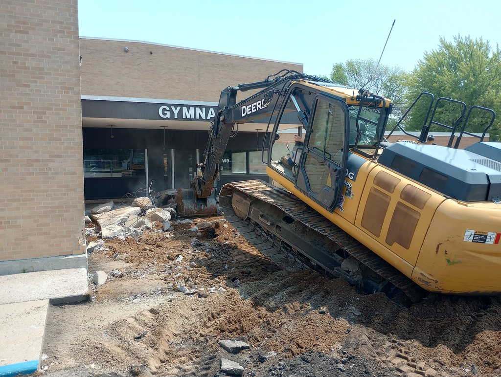 Digging footings on West side of building.