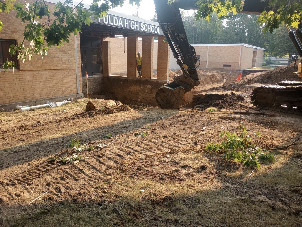 Digging footings on South side of building.