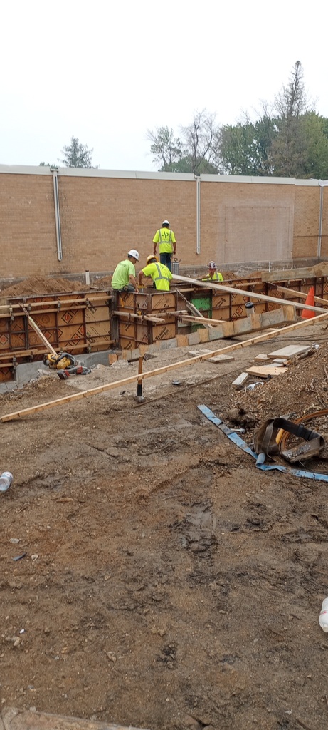 Installing foundation forms on the south side of building.