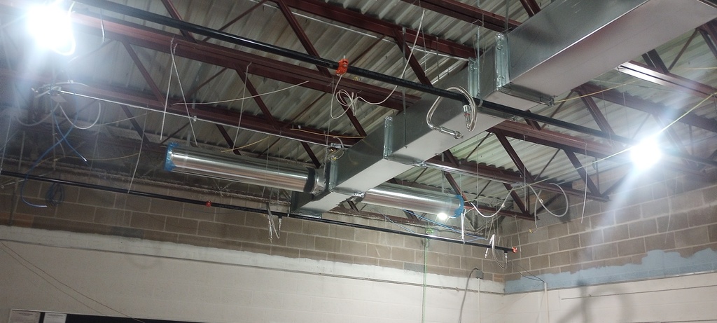 Roughing in of the HVAC and fire sprinkler system in the Ag classroom.