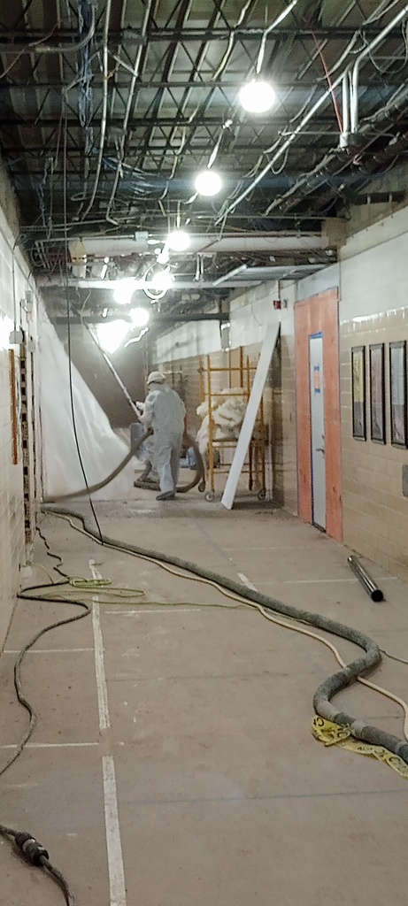Application of fire stop material to the fire wall which is the north wall of the north HS hallway.
