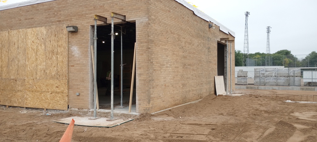 Shoring was placed to allow for wall opening removal. Access from the existing Ag Shop into the new north addition.